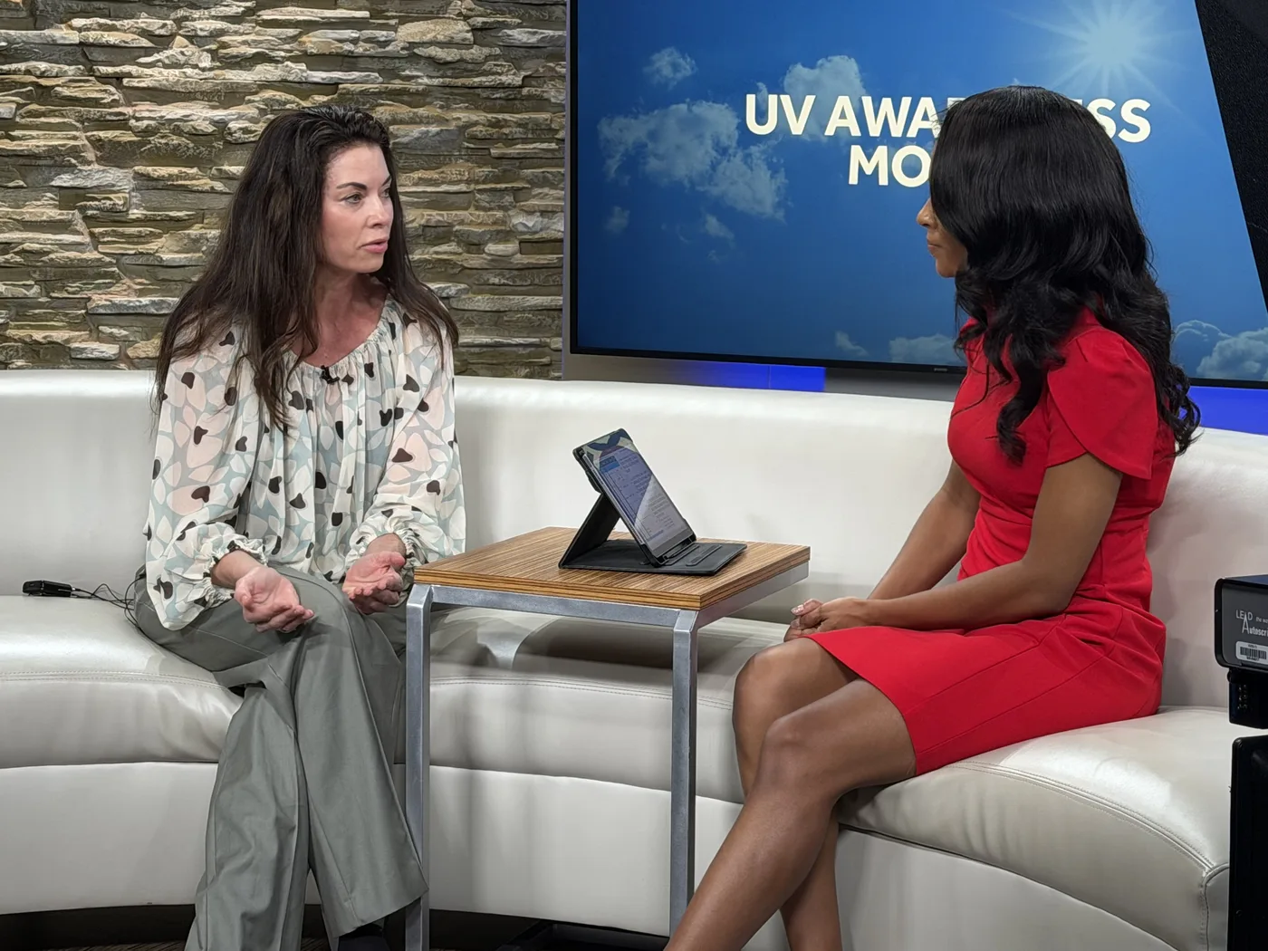 Natasha Simonson, PA-C, speaking with a KOCO 5 host about UV Awareness Month.
